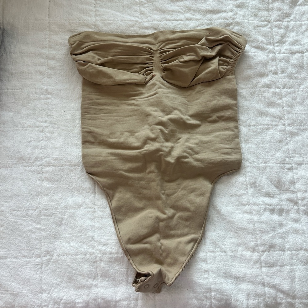SKIMS Seamless Sculpt Strapless Thong Bodysuit in Clay